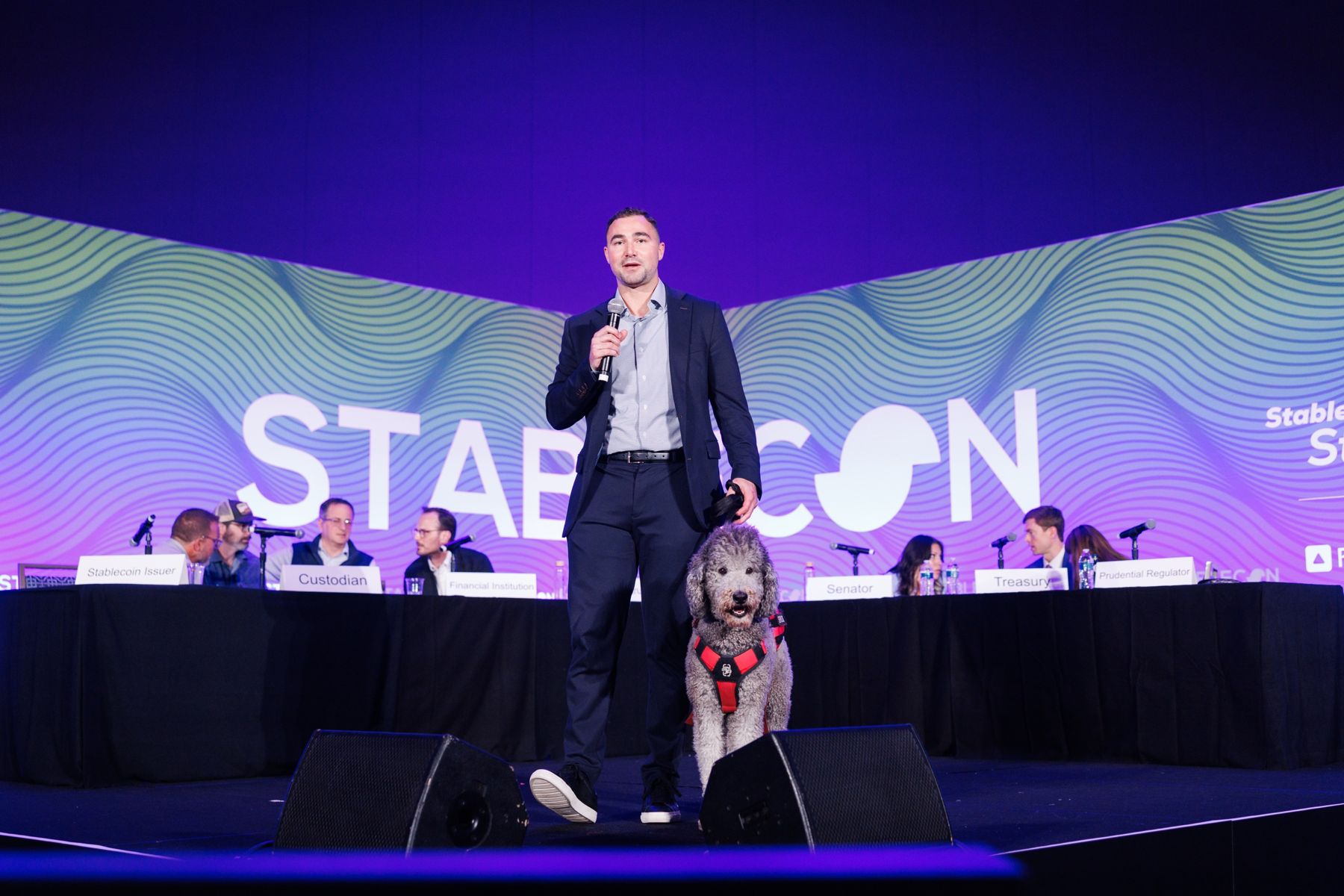 Dominic Zagara speaking on the StableCon main stage in front of a panel of regulators, issuers, and financial institutions